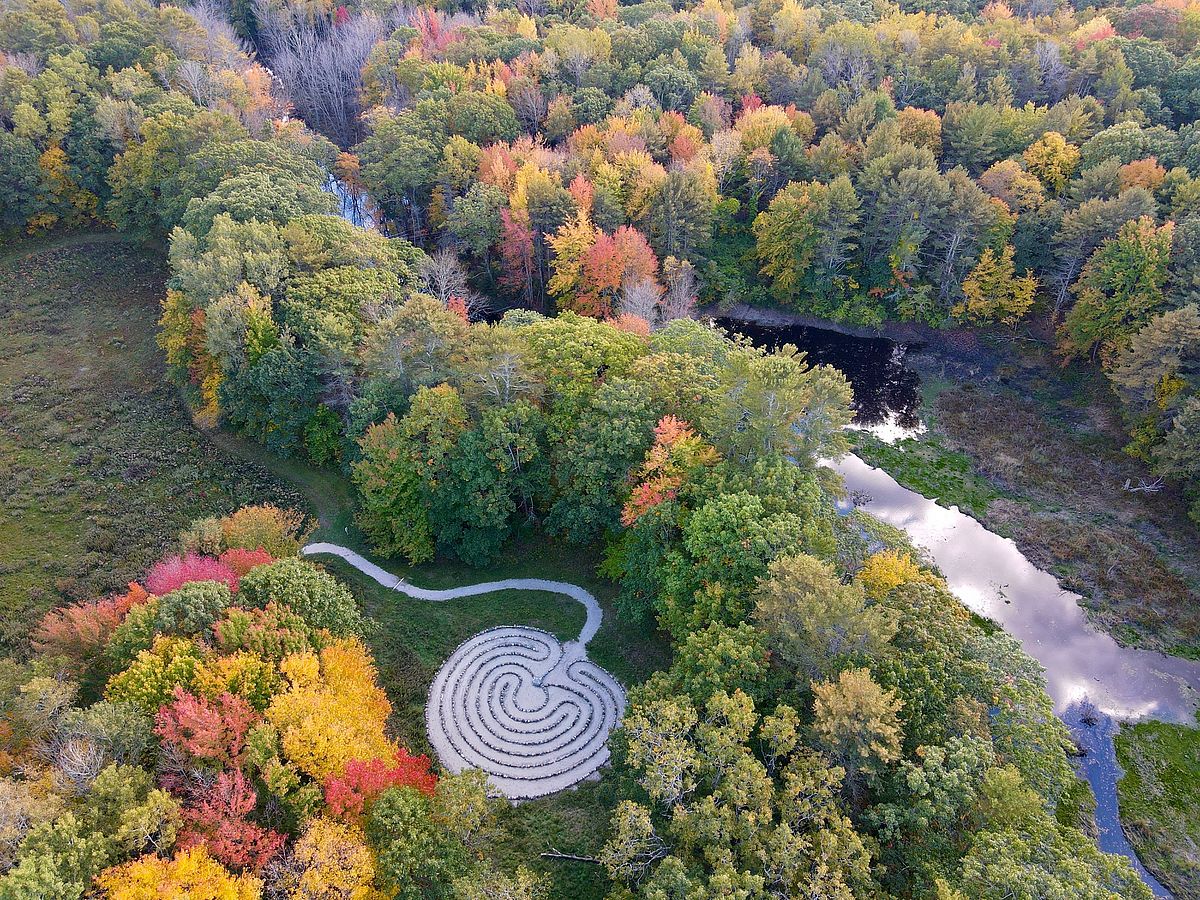 The Labyrinth framed by fall foliage at Emmons Preserve